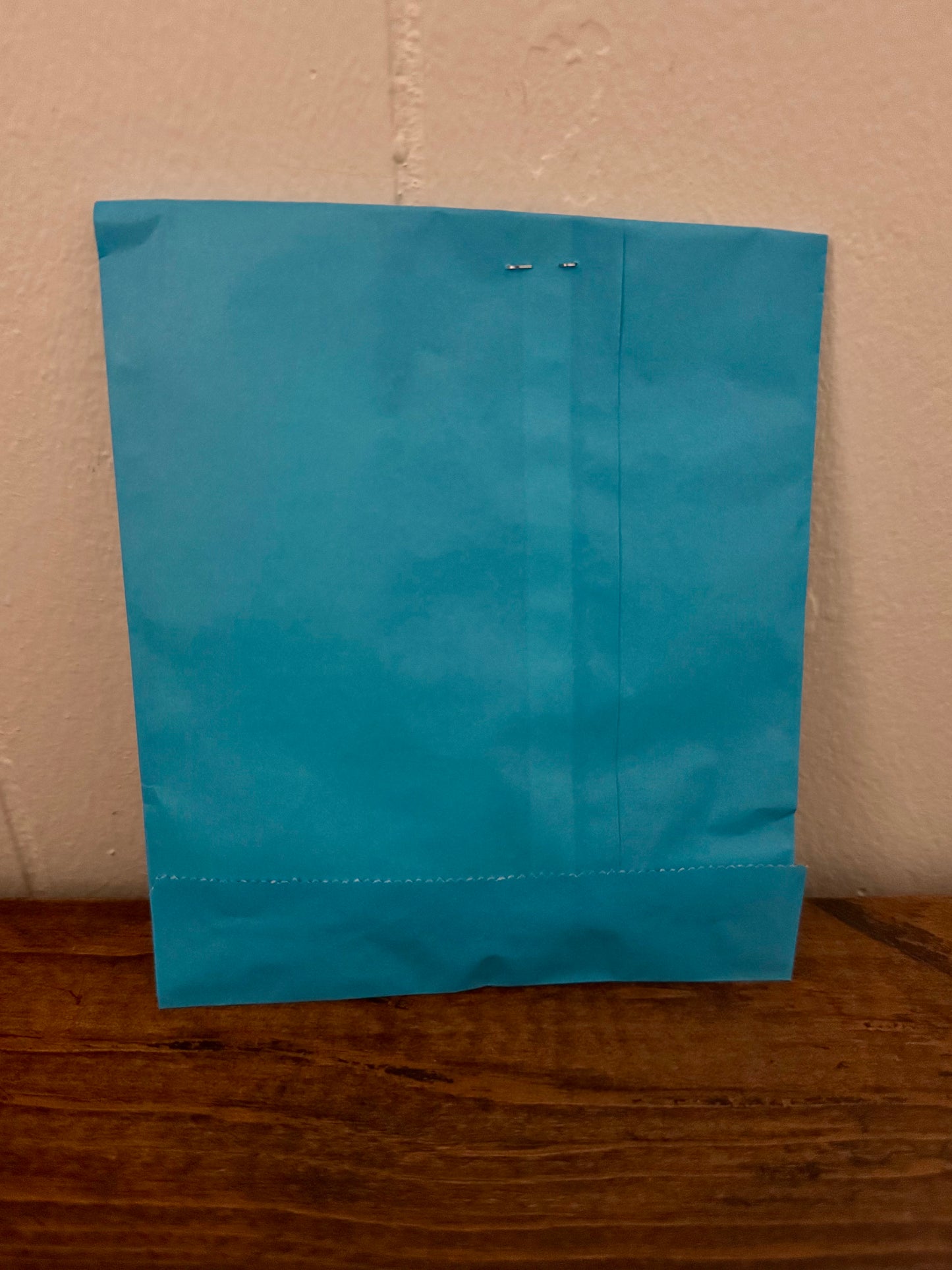 Blue bookish surprise bag filled with small reading-themed goodies and mystery gifts, inspired by blind date style bundles.