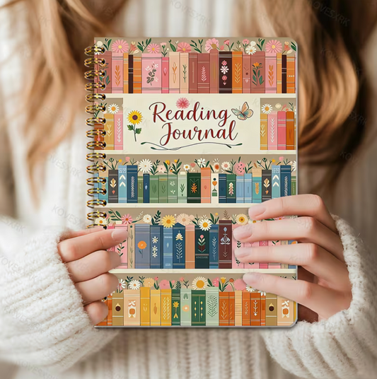 Reading Journal with colorful bookshelf design held by a person wearing a white sweater.