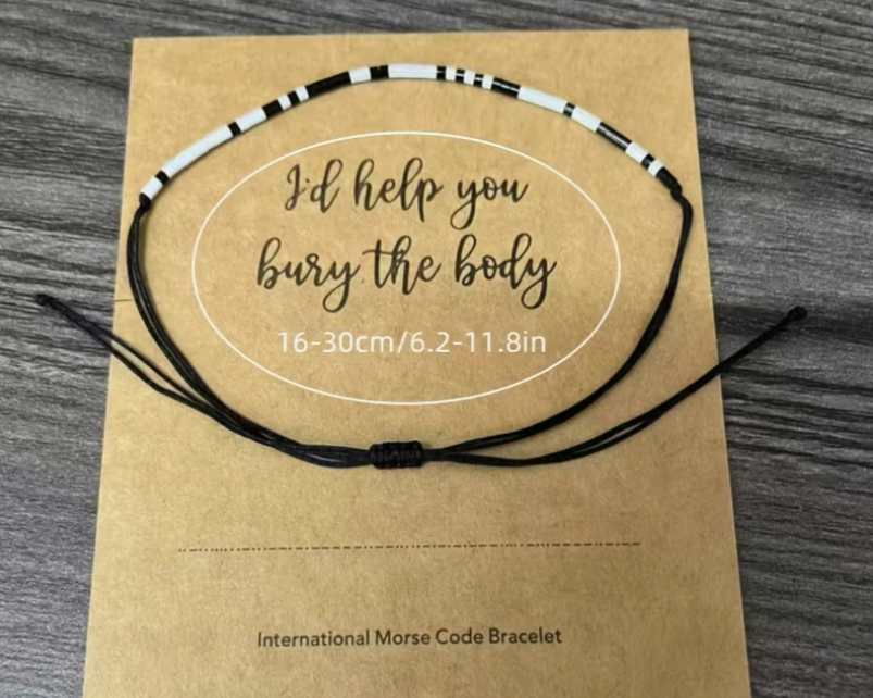 Morse code bracelet on a brown card with text