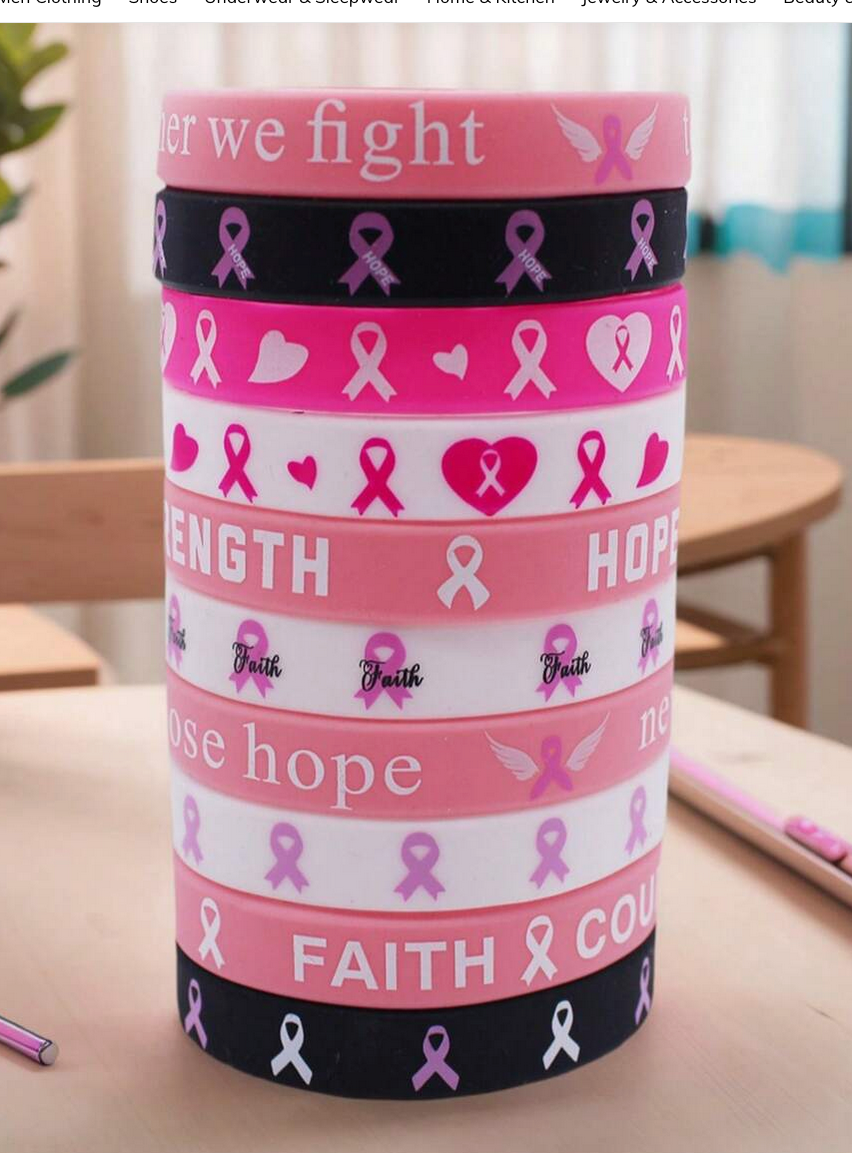Pink cylindrical container with cancer awareness designs on a table.