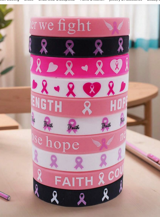 Pink cylindrical container with cancer awareness designs on a table.