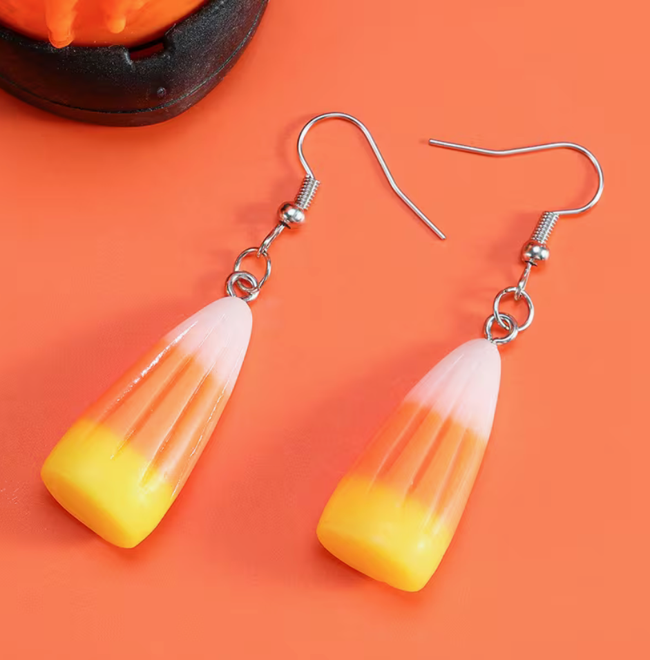 White orange and yellow candy corn acrylic dangle earrings with silver-tone hooks for Halloween.