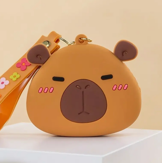 Brown bear-shaped pouch with a strap on a beige background