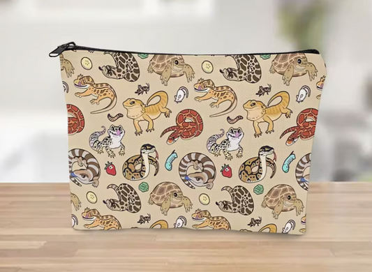 linen zipper pouch with cartoon reptile print featuring leopard geckos, snakes, tortoises, and small colorful reptile illustrations on a neutral background