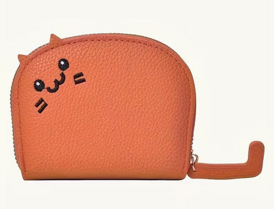 Orange faux leather cat-shaped wallet with embroidered face and tail zipper pull