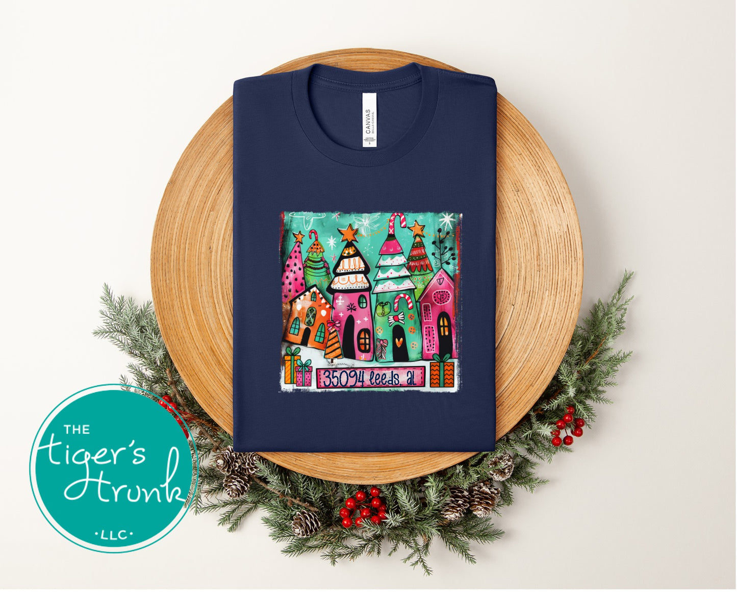 Navy Christmas shirt with colorful holiday houses and the text 35094 Leeds AL