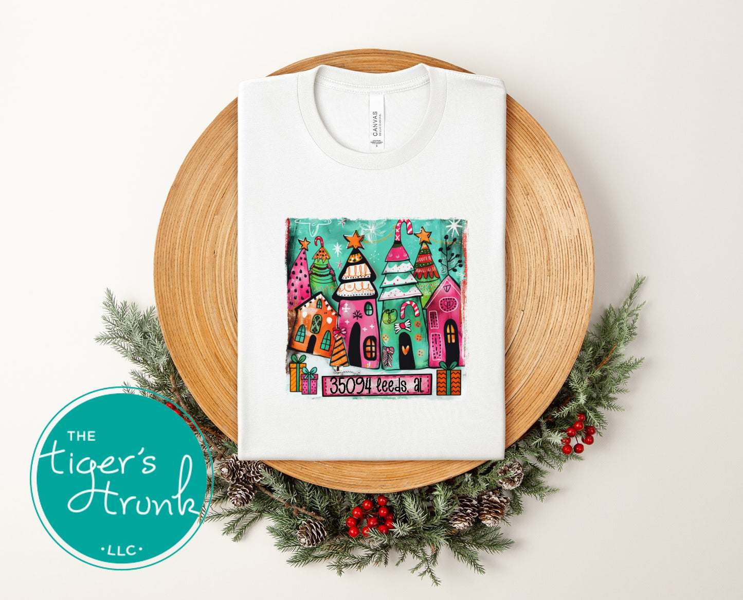 White Christmas shirt with colorful holiday houses and the text 35094 Leeds AL