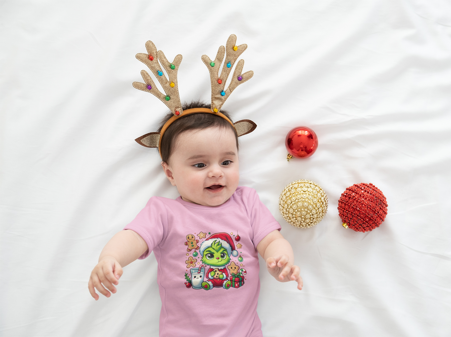 Baby bodysuit featuring an image of the Baby Grinch, perfect for a festive infant holiday outfit