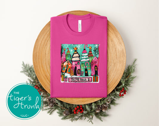 Berry pink Christmas shirt with festive village scene and 35094 Leeds AL personalization