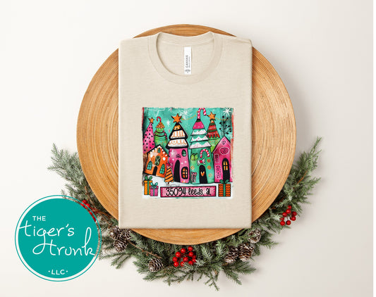 Natural heather Christmas shirt with colorful whimsical holiday village and 35094 Leeds AL personalization