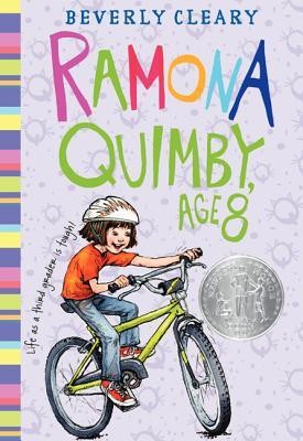 Front cover of Ramona Quimby, Age 8 by Beverly Cleary, featuring an illustration of Ramona smiling brightly while riding her bicycle.