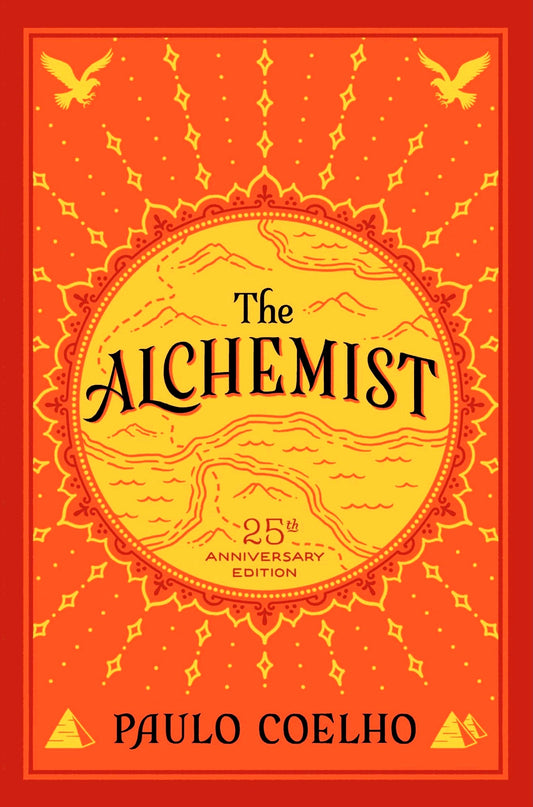 Cover of The Alchemist by Paulo Coelho, featuring an illustration of a desert landscape with pyramids under a golden sky.