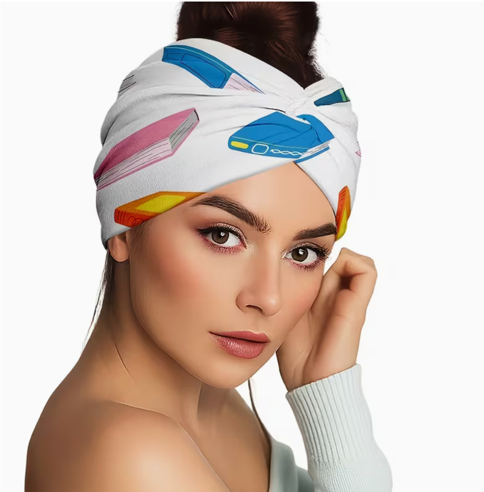 Woman wearing a white twist headband featuring a colorful book print