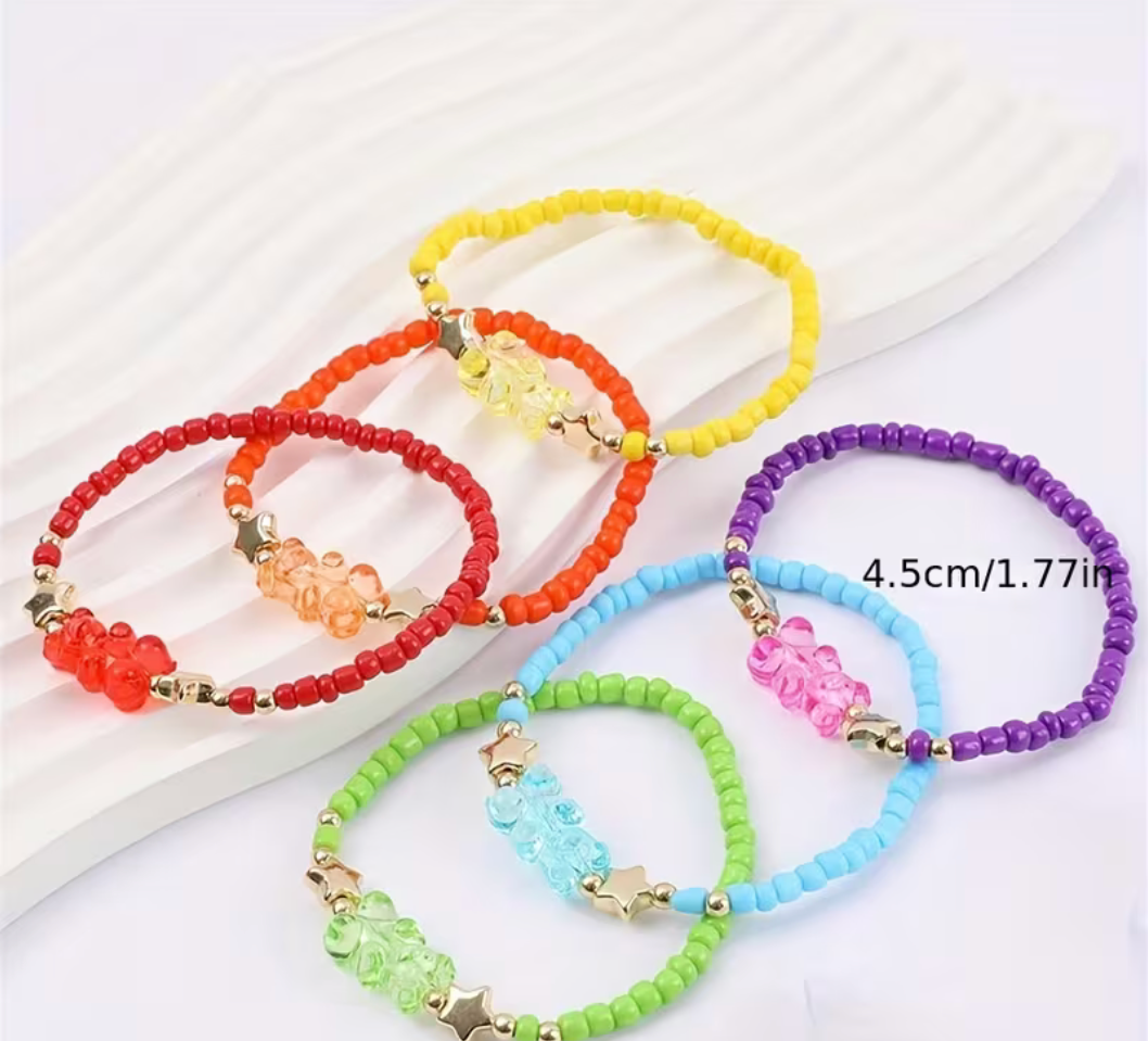 Set of colorful beaded bracelets on a white background