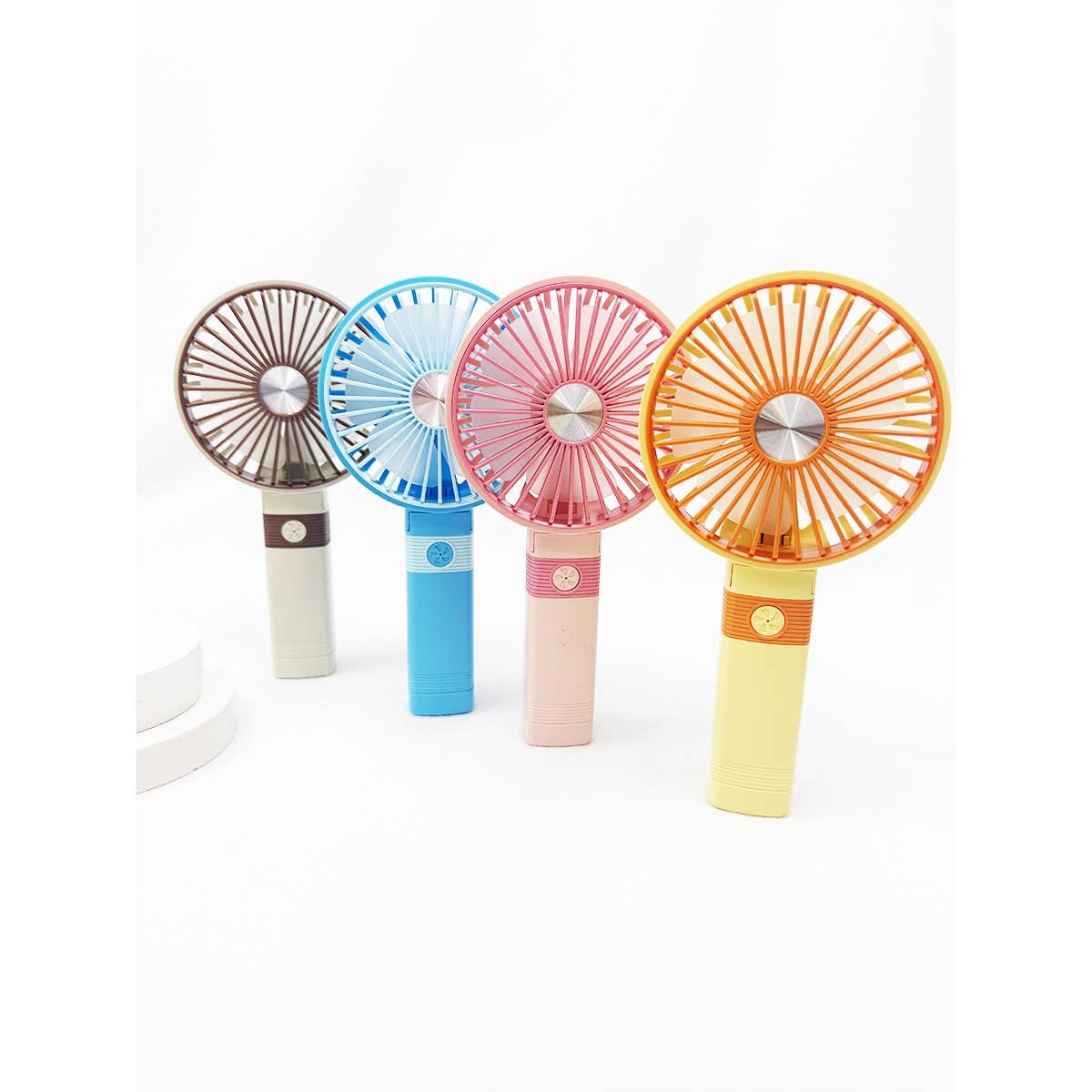 Assorted handheld rechargeable cooling fans standing upright