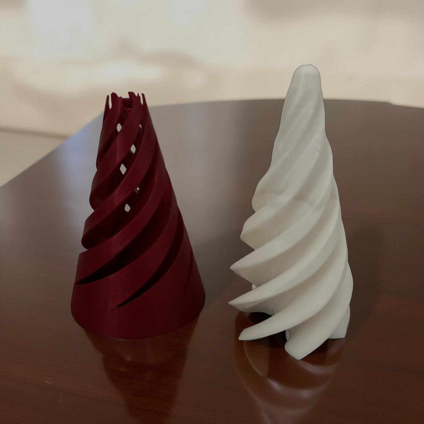Red and white striped 3D printed cone fidget puzzle standing on a wooden surface.