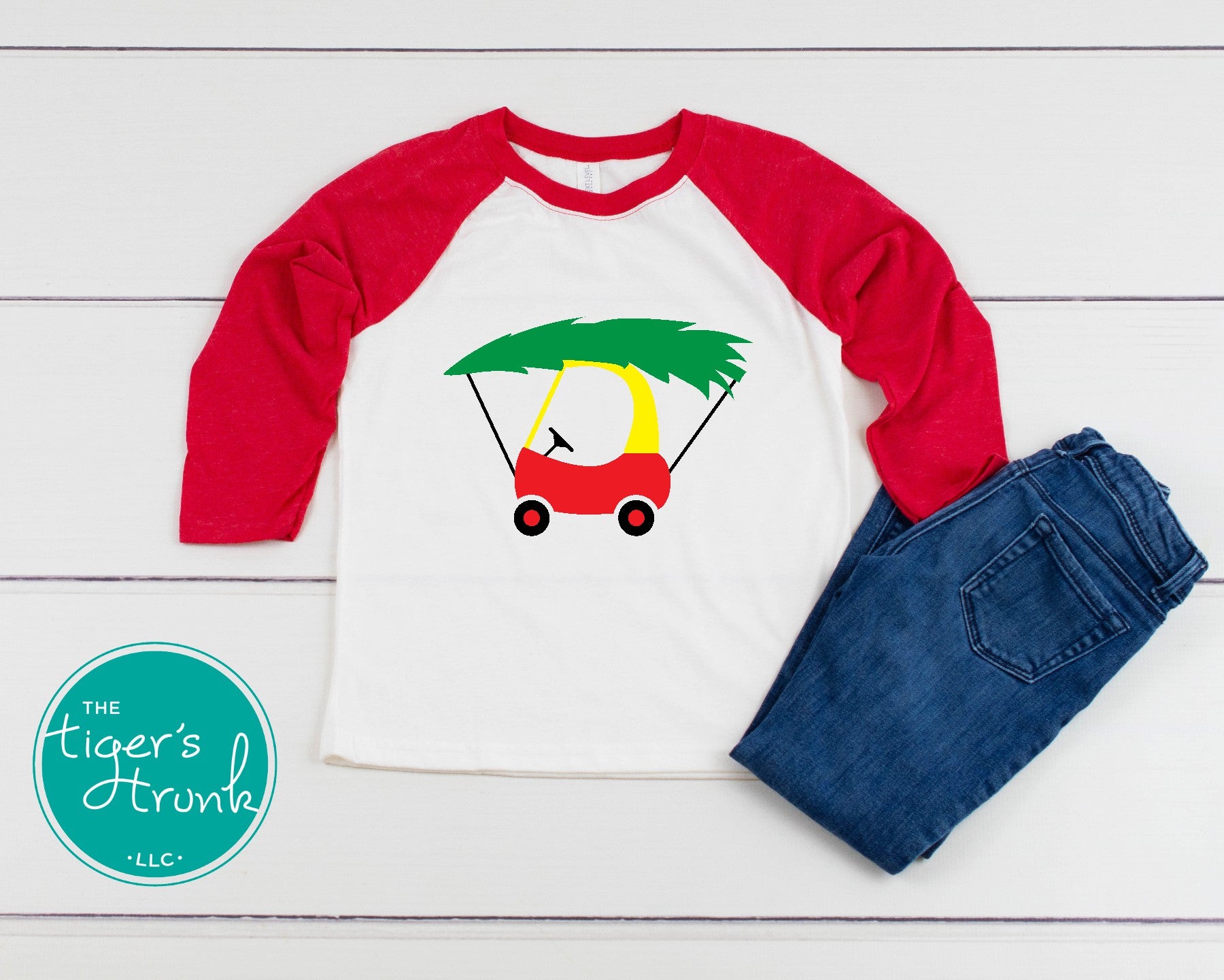 Toddler shirt with a red and yellow Cozy Coupe car carrying a green Christmas tree on top