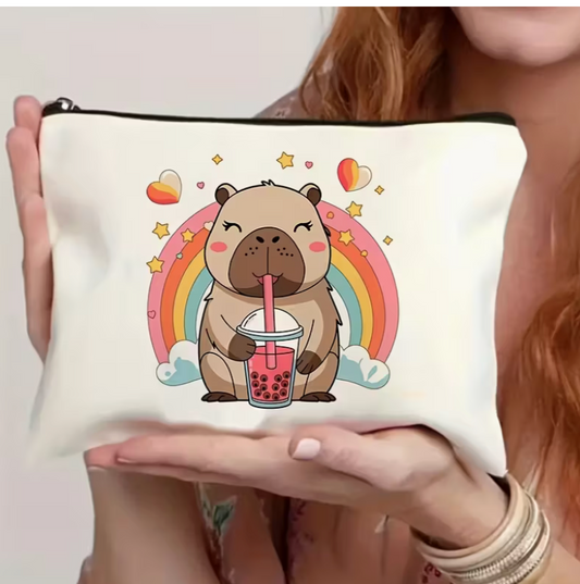 cute capybara makeup bag featuring a cartoon capybara drinking boba tea with rainbow and heart artwork on a white zipper pouch