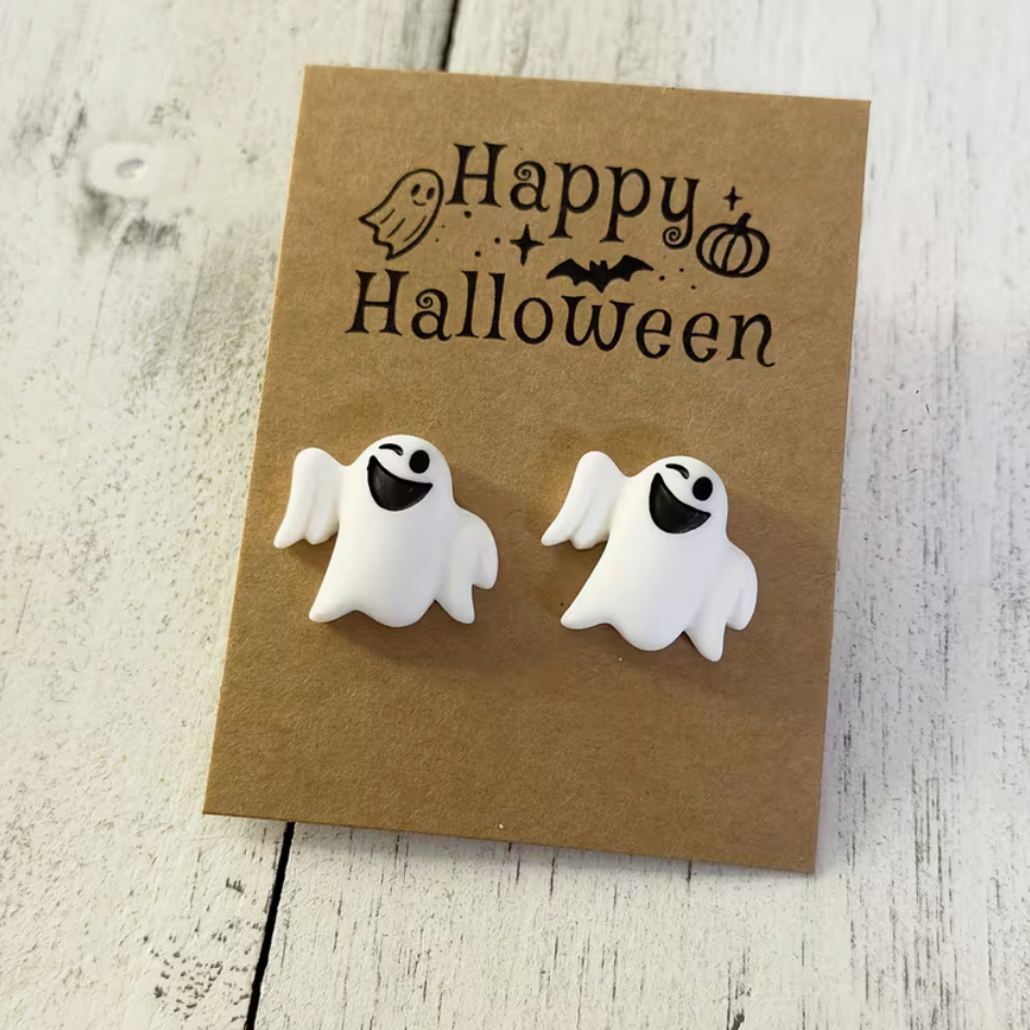 Pair of cute white resin ghost stud earrings with smiling black faces for Halloween