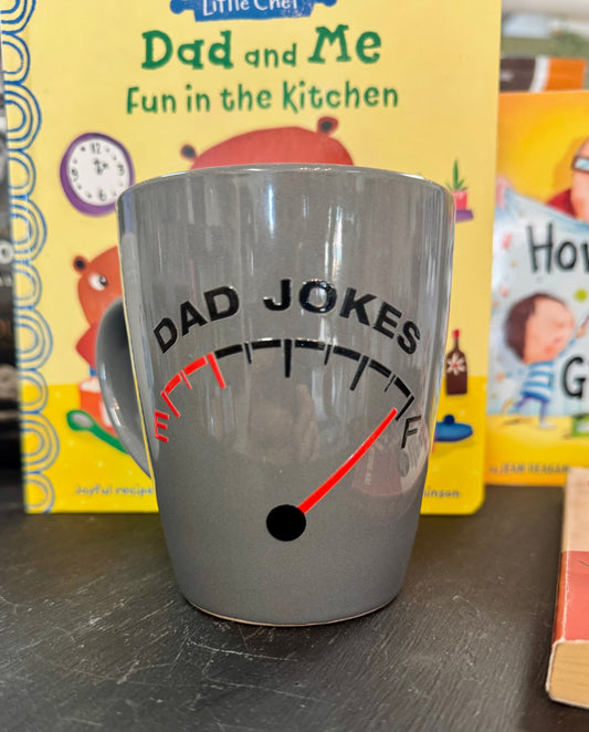 Ceramic coffee mug with the phrase Dad Jokes and a fuel gauge illustration showing Full