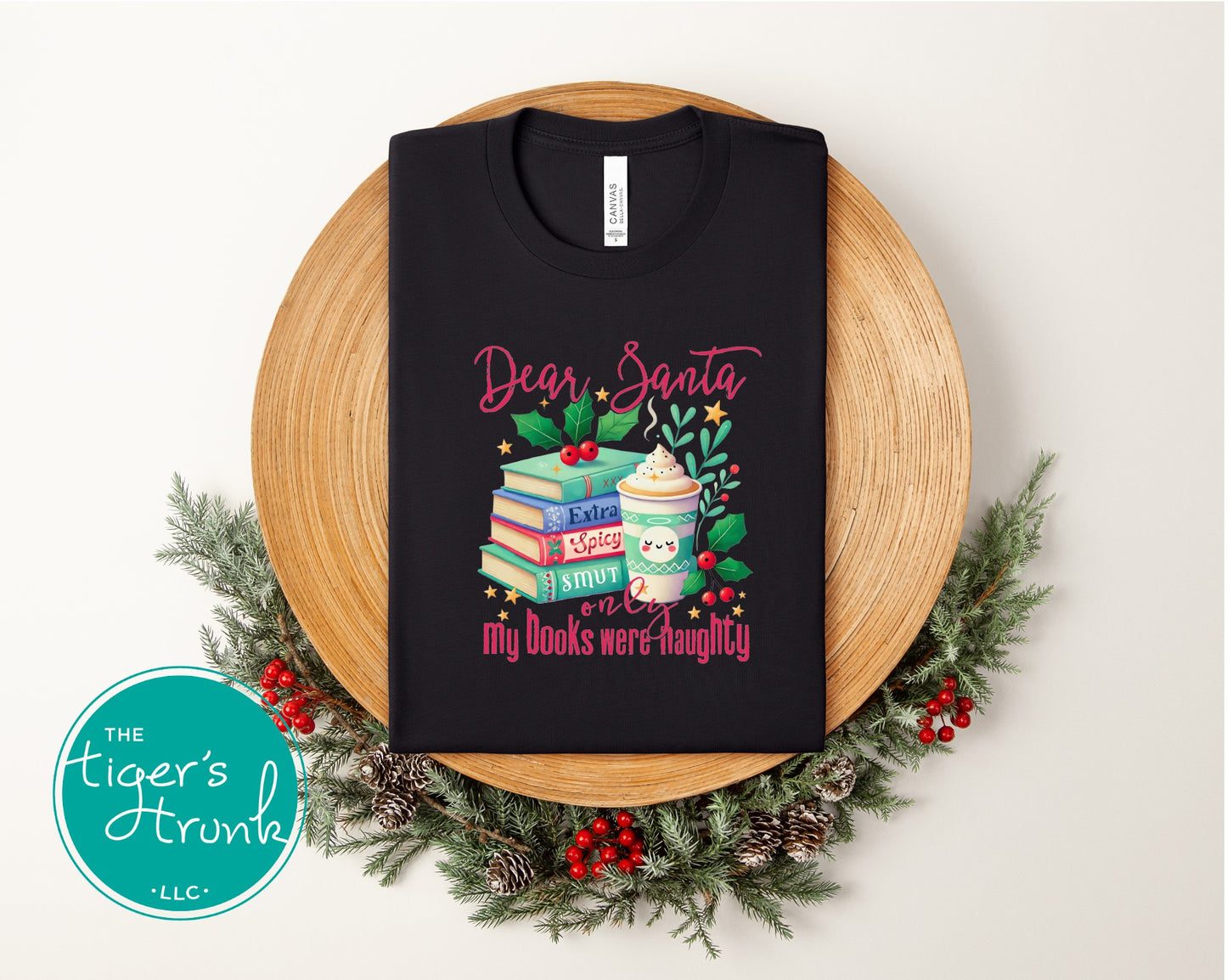 Black shirt with festive extra spicy book lover Christmas design featuring stacked books, holly, and a holiday drink.