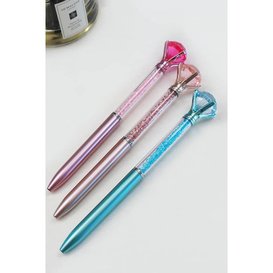 Glittery fun pen topped with a large faux diamond, perfect for writing, journaling, or gifting to kids and teens.