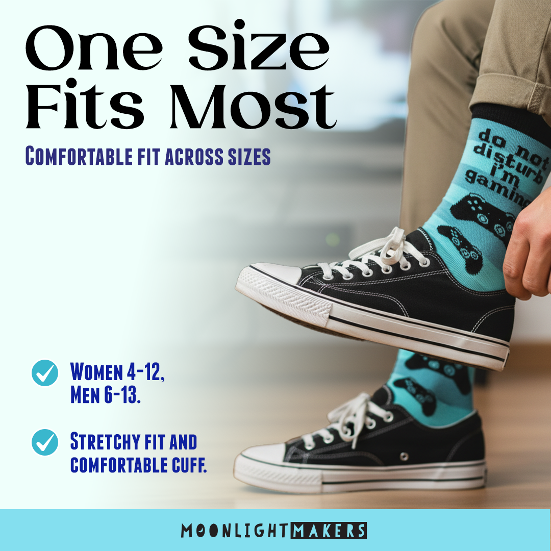 Promotional image showing Do Not Disturb I’m Gaming blue crew socks worn with black sneakers, highlighting one size fits most sizing for women 4–12 and men 6–13, with Moonlight Makers branding.