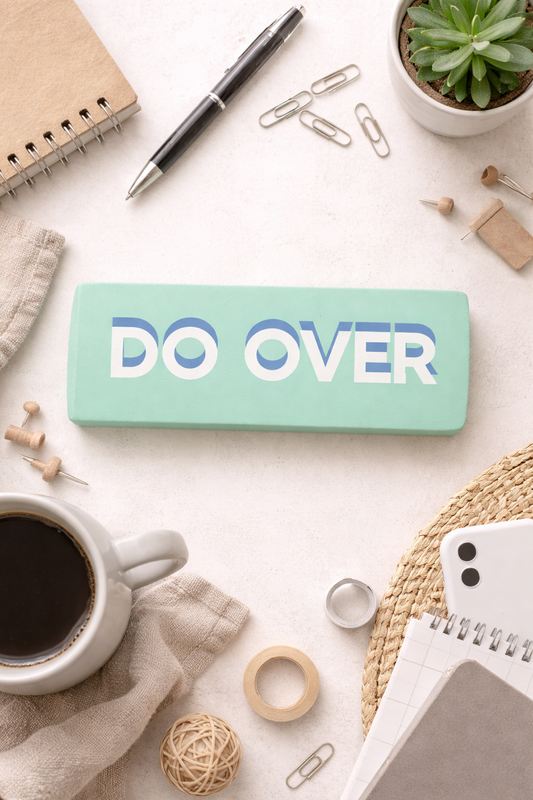 Large mint green novelty eraser with the words Do Over printed on it displayed as a funny desk accessory
