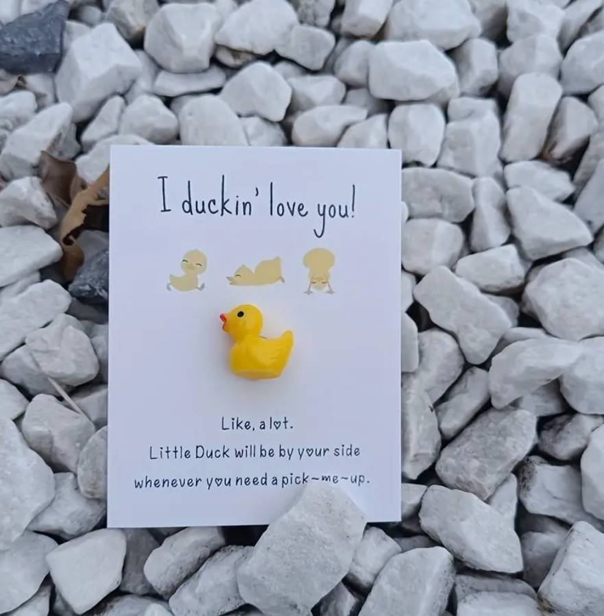 Yellow duck pocket hug with the message: I duckin' love you! like, a lot. little duck will be by your side whenever you need a pick-me-up.