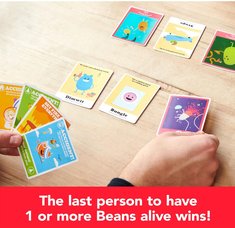 Players using action cards during a round of the Dumb Ways to Die card game with colorful animated bean character cards