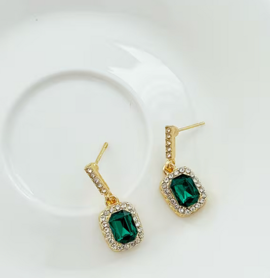 Emerald green rectangular faux gemstone drop earrings with gold-tone settings and sparkling clear rhinestone accents