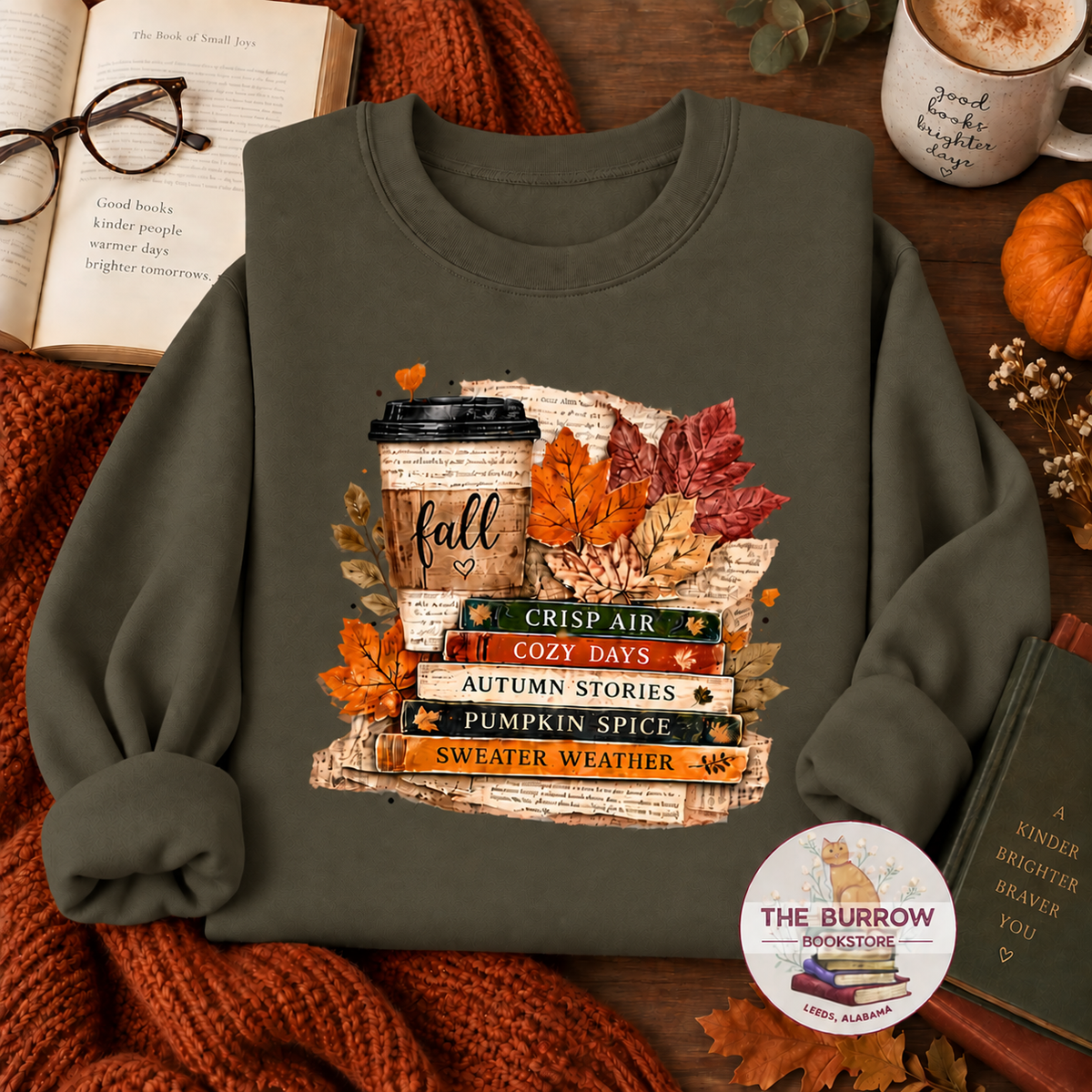 Fatigue green fall reading sweatshirt with stacked books, coffee cup and autumn leaves
