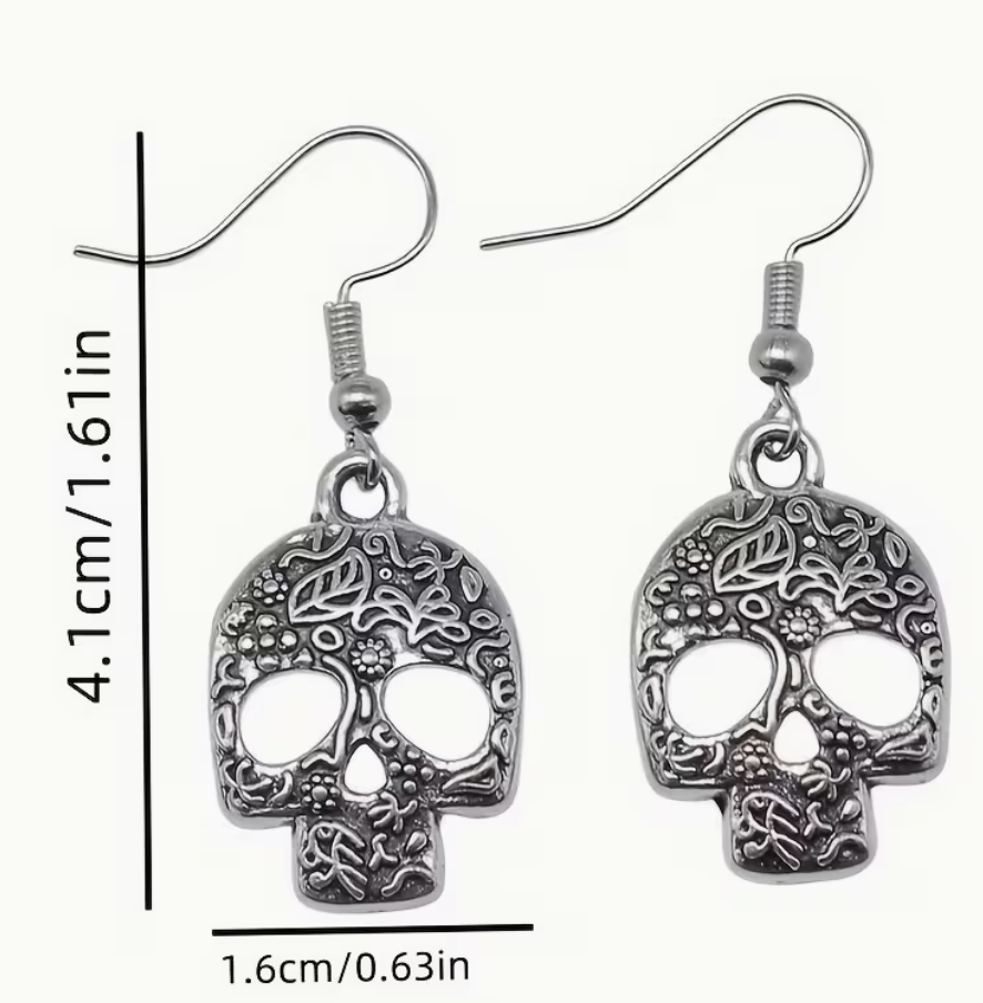 Silver-tone floral skull dangle earrings showing approximately 1.61 inch length and 0.63 inch skull width