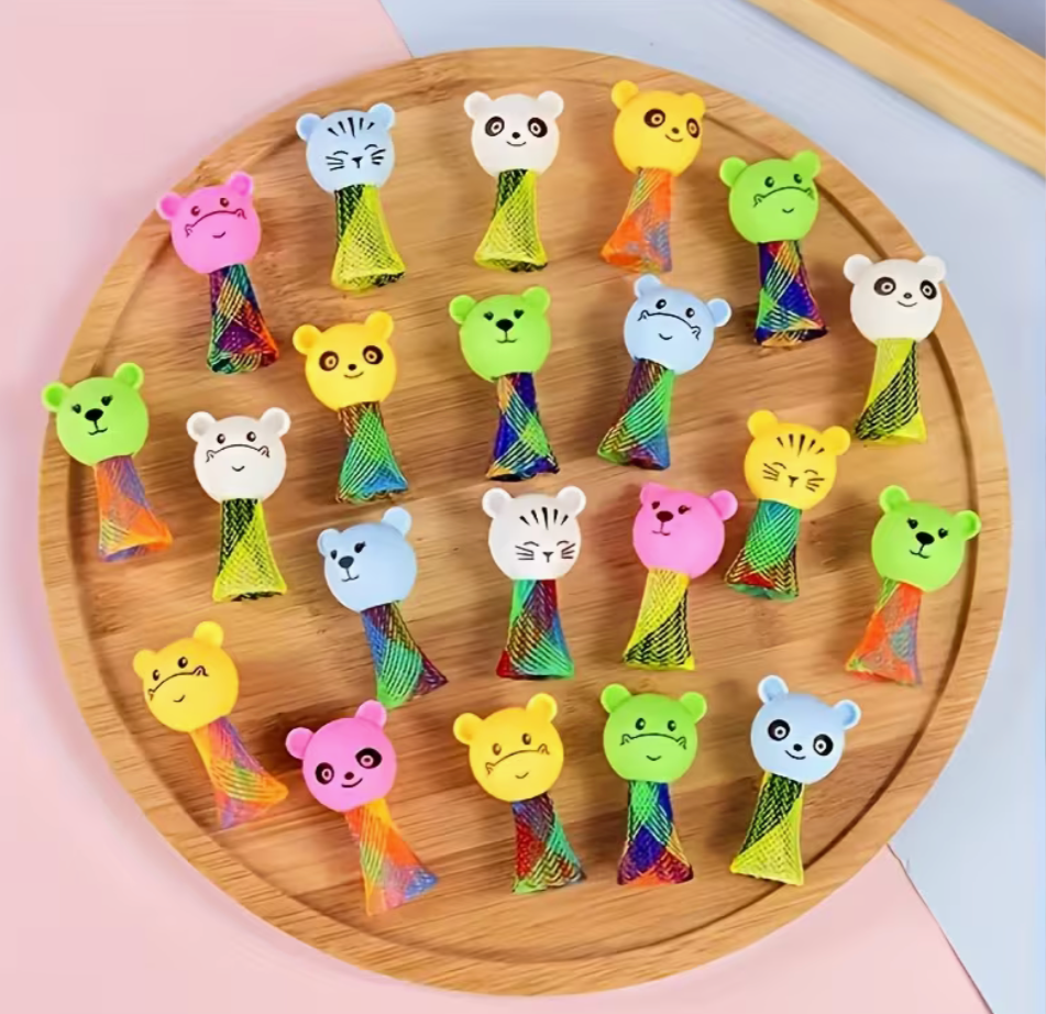 Assorted animal jumping toys displayed on round wooden tray in mixed colors