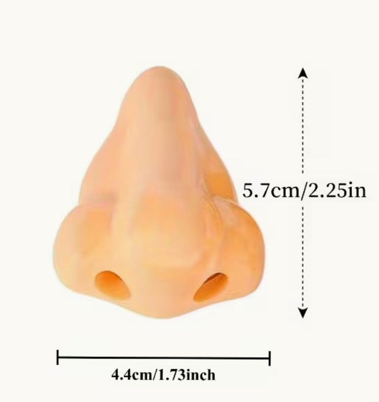 A peach-colored silicone nose model with printed nostril details, shown with dimension markings indicating a height of 5.7 cm (2.