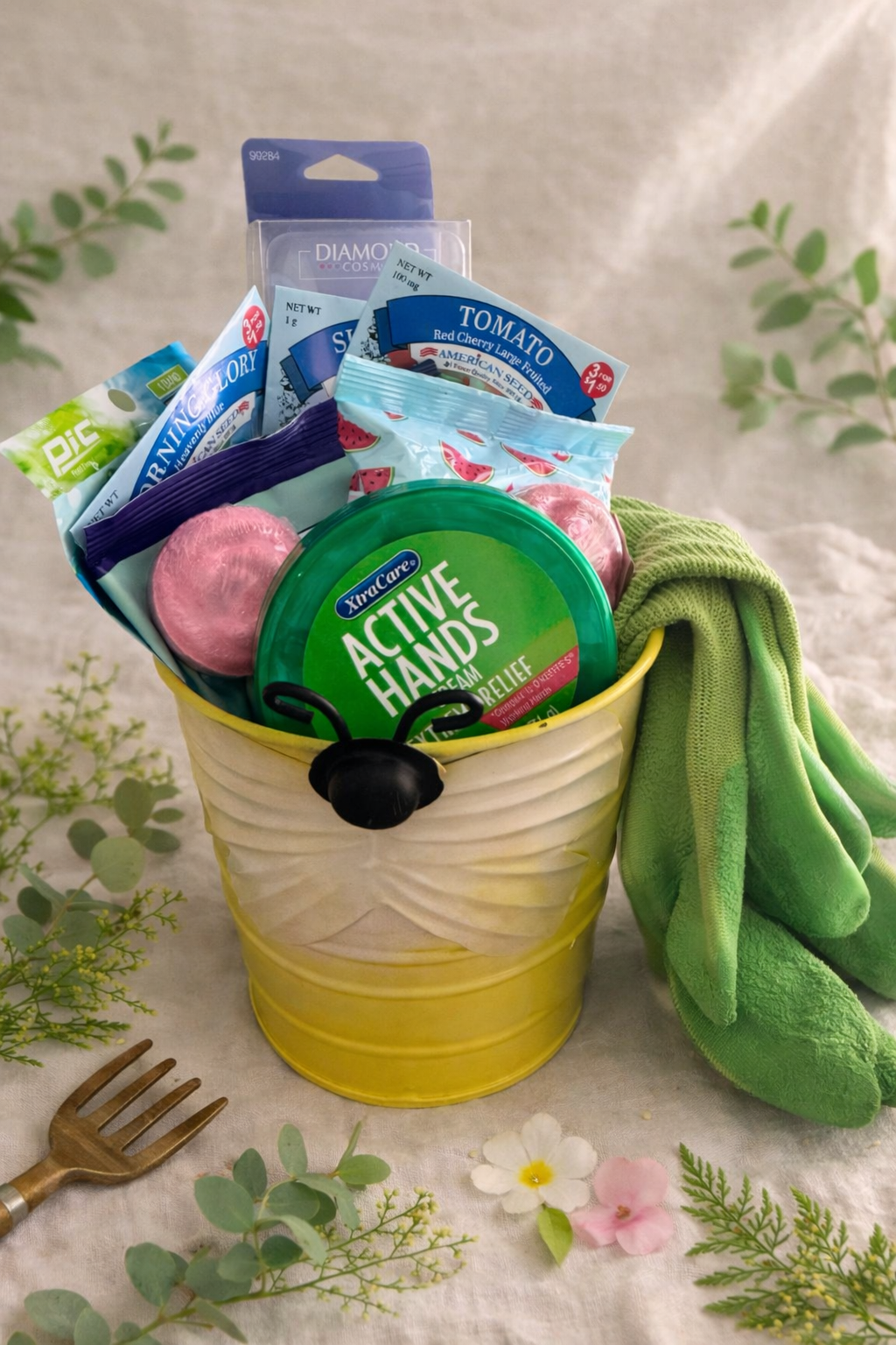 Yellow bucket with cleaning supplies including a green bottle labeled 'Active Hands' on a floral-patterned surface.