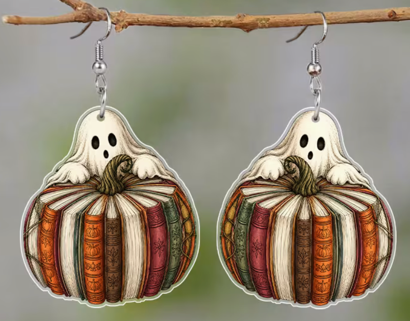 Pair of Halloween acrylic earrings featuring a cute ghost peeking over a pumpkin made from vintage-style books