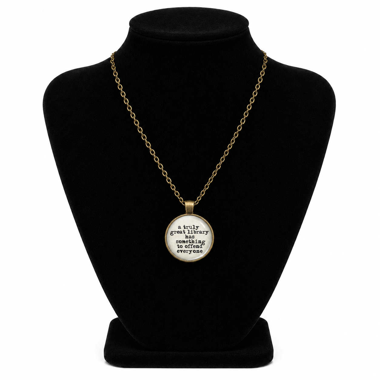 Vintage bronze-tone literary necklace with glass pendant reading A Truly Great Library Has Something to Offend Everyone.