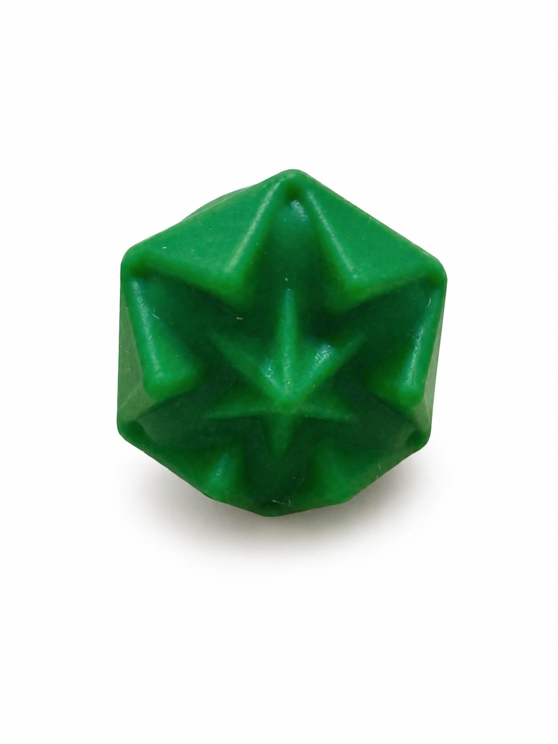 Green geometric silicone fidget ring with raised angular texture for tactile sensory relief