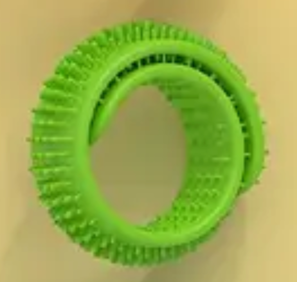 Green circular object with textured surface on a beige background