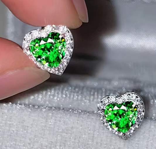 Green heart shaped rhinestone stud earrings with sparkling halo and silver tone setting