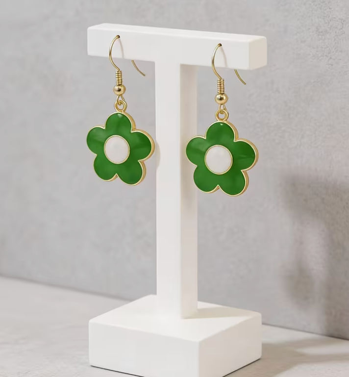Green daisy flower dangle earrings with white centers, gold-tone outlines and gold fishhook ear wires, measuring approximately 1.54 inches long