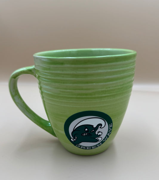 Green mug with a logo on a light background