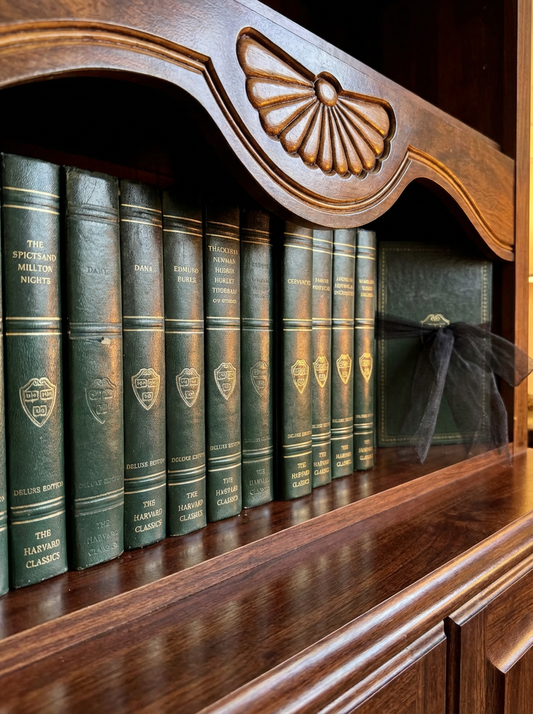 Vintage green Harvard Classics Registered Edition volumes from 1937–1938 displayed on a wooden bookshelf with carved detailing, partial set shown in uniform bindings