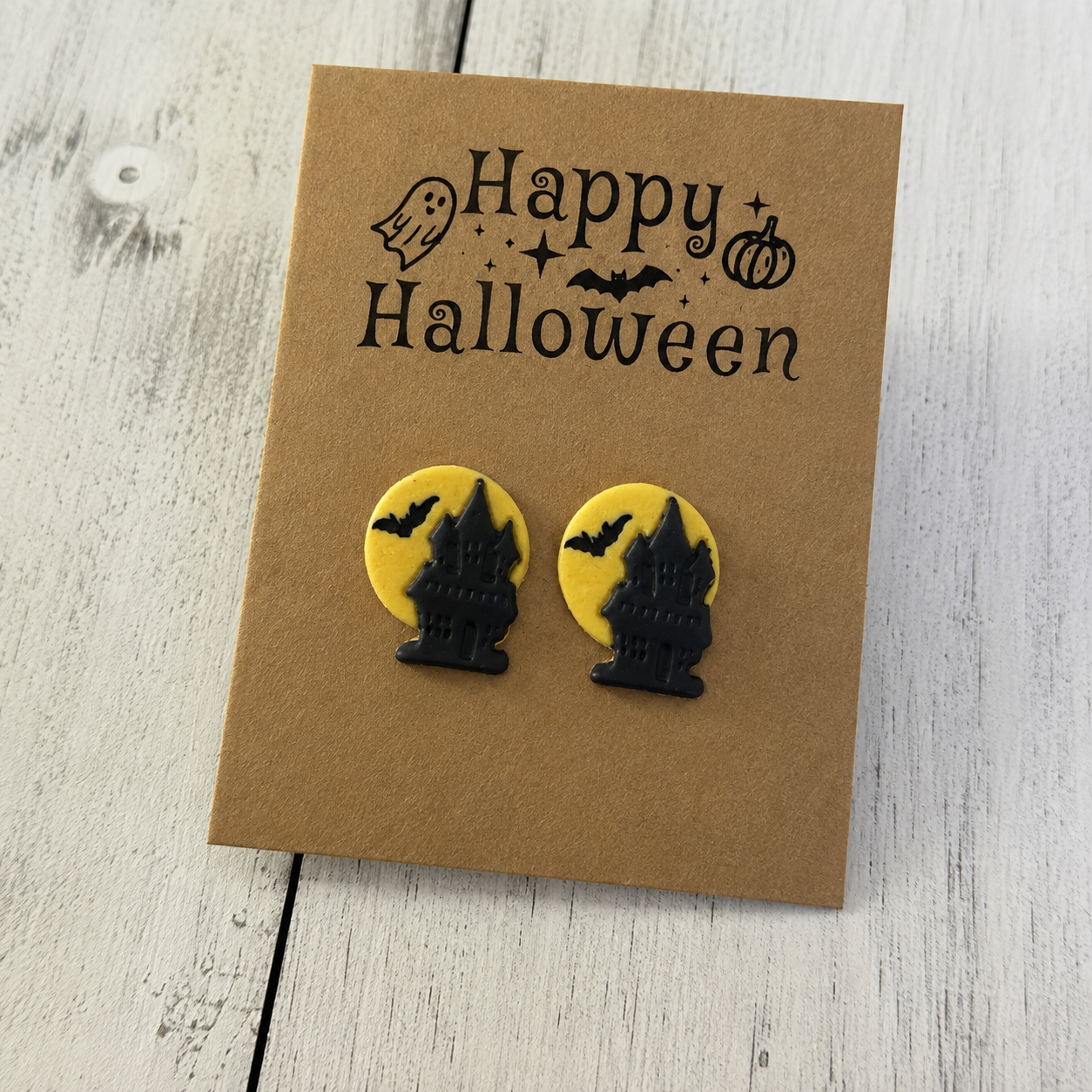 Black haunted house resin stud earrings with yellow moon and bat Halloween design