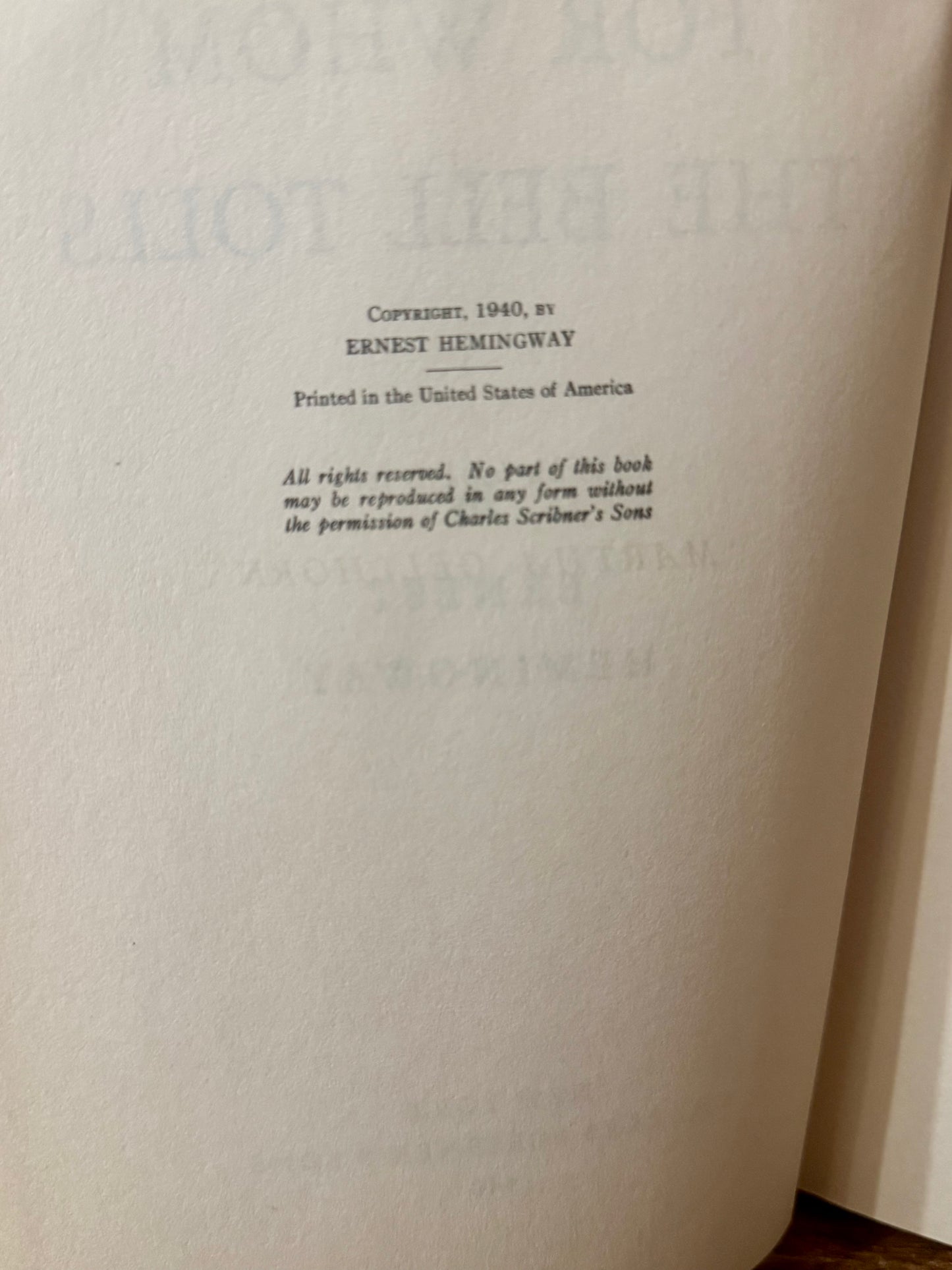 Cover of For Whom the Bell Tolls by Ernest Hemingway, 1940 vintage edition, featuring a classic design with bold typography and a landscape illustration.