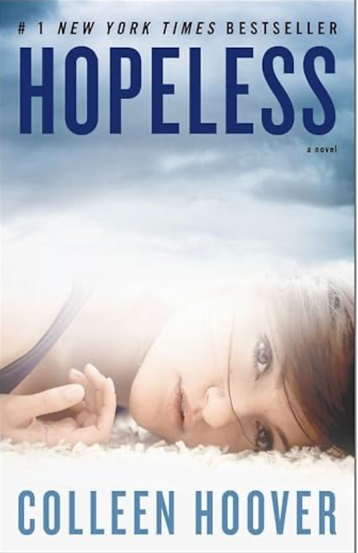 Front cover of Hopeless by Colleen Hoover, featuring a minimalist blue design with a young woman lying in a field of grass.