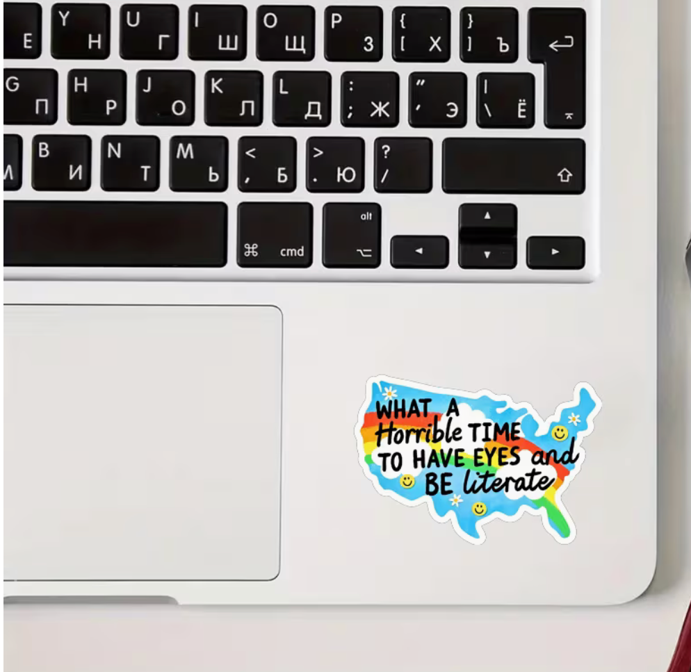 Colorful United States map sticker reading What a Horrible Time to Have Eyes and Be Literate