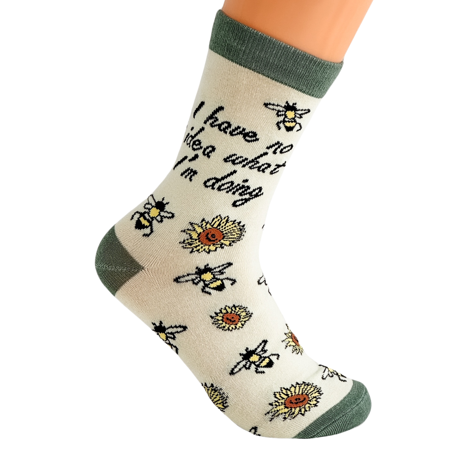 Single I have no idea what I’m doing novelty crew sock with bee and sunflower pattern in soft yellow and green, shown worn on a foot against a white background to highlight fit and heel shape.