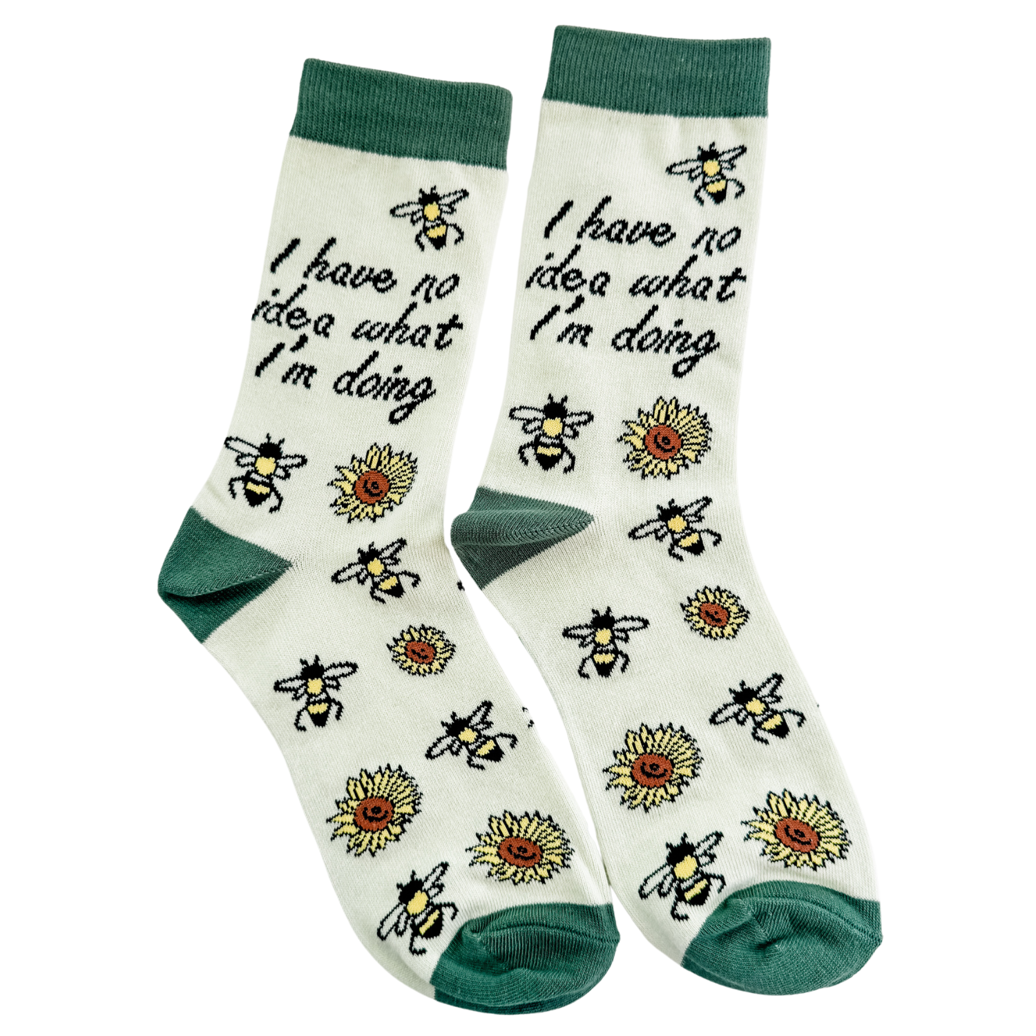 Pair of novelty crew socks reading I have no idea what I’m doing with bee and sunflower illustrations, cream background with green cuffs and toes, shown on a white background for gift and everyday wear.